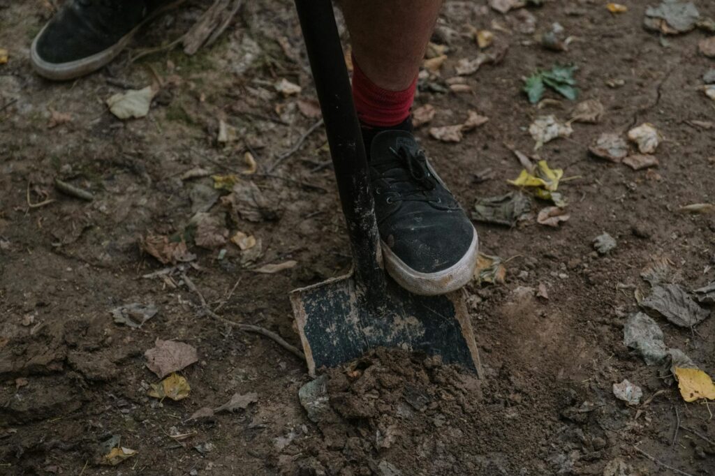 a person using a shovel